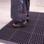 Person standing on SureFoot Anti-fatigue Mat
